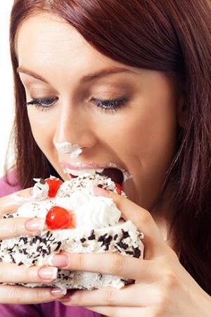 7445_gluttonous-woman-eating-pastry