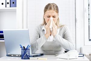 7445_woman-blowing-her-nose-feeling-unwell